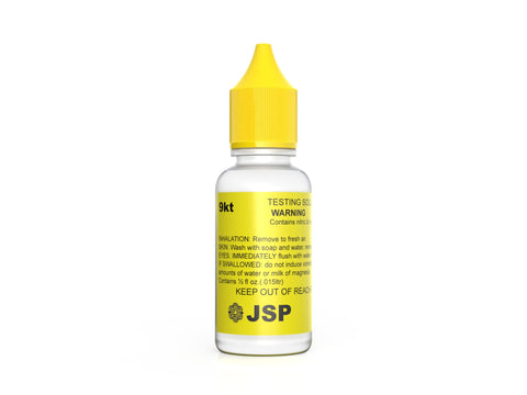 A bottle of 9kt gold testing solution with a yellow cap and label, marked with safety and content information.