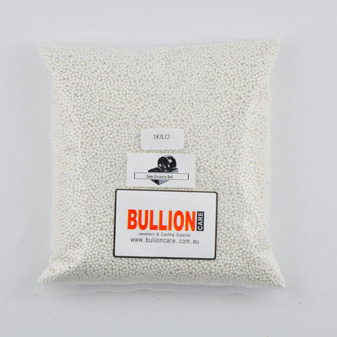 Bag of 2mm white zirconia tumbling beads, marked '1 Kilo', with the 'BULLIONCARE' logo.