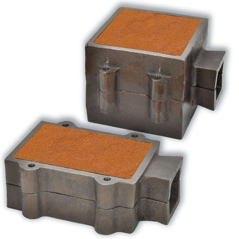Metal casting flasks with sand molds for industrial foundry use, isolated on white background.